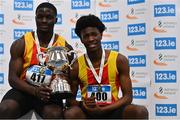 18 February 2024; Israel Olatunde of Tallaght AC, left, poses for a photograph with his gold medal and men's senior 60m trophy alongside silver medalist Sean Aigboboh of Tallaght AC, Dublin, after the senior men's 60m during day two of the 123.ie National Senior Indoor Championships at the Sport Ireland National Indoor Arena in Dublin. Photo by Tyler Miller/Sportsfile