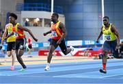 18 February 2024; Israel Olatunde of Tallaght AC, Dublin, centre, crosses the finsh line ahead of Sean Aigboboh of Tallaght AC, Dublin, left, and Bori Akinola of UCD AC, Dublin, to win the senior men's 60m during day two of the 123.ie National Senior Indoor Championships at the Sport Ireland National Indoor Arena in Dublin. Photo by Tyler Miller/Sportsfile
