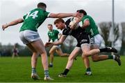 18 February 2024; Sean Carrabine of Sligo is tackled by Emmet Rigter of Limerick during the Allianz Football League Division 3 match between Limerick and Sligo at Mick Neville Park in Rathkeale, Limerick. Photo by Tom Beary/Sportsfile