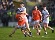 18 February 2024; Darragh Kirwan of Kildare is tackled by Andrew Murnin of Armagh during the Allianz Football League Division 2 match between Kildare and Armagh at Netwatch Cullen Park in Carlow. Photo by Piaras Ó Mídheach/Sportsfile