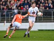 18 February 2024; Kevin Feely of Kildare in action against Connaire Mackin of Armagh during the Allianz Football League Division 2 match between Kildare and Armagh at Netwatch Cullen Park in Carlow. Photo by Piaras Ó Mídheach/Sportsfile