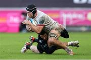 18 February 2024; Marcus Rea of Ulster is tackled by Alex Cuthbert of Ospreys during the United Rugby Championship match between Ospreys and Ulster at Swansea.com Stadium in Swansea, Wales. Photo by Chris Fairweather/Sportsfile