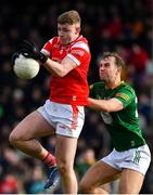 18 February 2024; Peter Lynch of Louth in action against Shane Walsh of Meath during the Allianz Football League Division 2 match between Meath and Louth at Páirc Tailteann in Navan, Meath. Photo by Shauna Clinton/Sportsfile