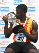 18 February 2024; Israel Olatunde of Tallaght AC, Dublin, celebrates with the men's 60m trophy after finshing first in the men's senior 60m during day two of the 123.ie National Senior Indoor Championships at the Sport Ireland National Indoor Arena in Dublin. Photo by Tyler Miller/Sportsfile