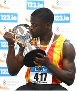 18 February 2024; Israel Olatunde of Tallaght AC, Dublin, celebrates with the men's 60m trophy after finshing first in the men's senior 60m during day two of the 123.ie National Senior Indoor Championships at the Sport Ireland National Indoor Arena in Dublin. Photo by Tyler Miller/Sportsfile