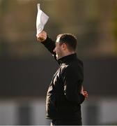 18 February 2024; Linesman Henry Barrett uses his flag to shade his eyes from the sun during the Allianz Football League Division 3 match between Wicklow and Westmeath at Echelon Park in Aughrim, Wicklow. Photo by Ray McManus/Sportsfile