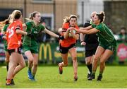 18 February 2024; Aimee Mackin of Armagh in action against Meath players Mary Kate Lynch, left, and Máire O'Shaughnessy during the Lidl LGFA National League Division 1 Round 4 match between Meath and Armagh at Donaghmore Ashbourne GAA Club in Ashbourne, Meath. Photo by Seb Daly/Sportsfile
