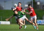 18 February 2024; Cian McBride of Meath in action against Conor Early, left, and Ciaran Downey of Louth during the Allianz Football League Division 2 match between Meath and Louth at Páirc Tailteann in Navan, Meath. Photo by Shauna Clinton/Sportsfile