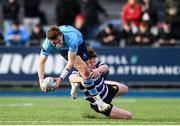 21 February 2024; Ethan Black of St Michael's College is tackled by Daniel Martin of Terenure College during the Bank of Ireland Leinster Schools Senior Cup quarter-final match between Terenure College and St Michael's College at Energia Park in Dublin. Photo by Shauna Clinton/Sportsfile
