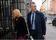 22 February 2024; FAI chief executive Jonathan Hill, right, and FAI independent director Catherine Guy arrive at Dáil Éireann in Dublin ahead of a meeting with the Committee of Public Accounts. Photo by Seb Daly/Sportsfile