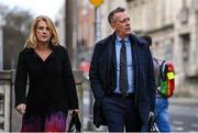 22 February 2024; FAI chief executive Jonathan Hill, right, and FAI independent director Catherine Guy arrive at Dáil Éireann in Dublin ahead of a meeting with the Committee of Public Accounts. Photo by Seb Daly/Sportsfile