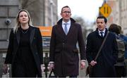 22 February 2024; FAI chief operating officer David Courell, centre, FAI finance director Dan McCormack, right, and FAI director of marketing and communications Louise Cassidy arrive at Dáil Éireann in Dublin ahead of a meeting with the Committee of Public Accounts. Photo by Seb Daly/Sportsfile
