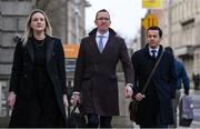 22 February 2024; FAI chief operating officer David Courell, centre, FAI finance director Dan McCormack, right, and FAI director of marketing and communications Louise Cassidy arrive at Dáil Éireann in Dublin ahead of a meeting with the Committee of Public Accounts. Photo by Seb Daly/Sportsfile