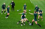 22 February 2024; Caitlin Hayes in action against Diane Caldwell and Emily Murphy, left, during a Republic of Ireland women training session at Viola Park in Florence, Italy. Photo by David Fitzgerald/Sportsfile