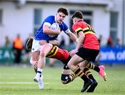 23 February 2024; Zack Hopkins of St Mary’s College is tackled by Milo Quinn of CBC Monkstown during the Bank of Ireland Leinster Schools Senior Cup quarter-final match between CBC Monkstown and St Mary's Collegee at Energia Park in Dublin. Photo by Daire Brennan/Sportsfile