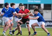 23 February 2024; Louis Cahill of CBC Monkstown is tackled by David Leane, left, and Gregory Ewing of St Mary’s College during the Bank of Ireland Leinster Schools Senior Cup quarter-final match between CBC Monkstown and St Mary's Collegee at Energia Park in Dublin. Photo by Daire Brennan/Sportsfile