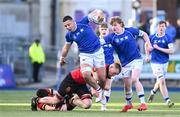 23 February 2024; Aaron O’Brien of St Mary’s College is tackled by Charlie Meagher of CBC Monkstown during the Bank of Ireland Leinster Schools Senior Cup quarter-final match between CBC Monkstown and St Mary's Collegee at Energia Park in Dublin. Photo by Daire Brennan/Sportsfile