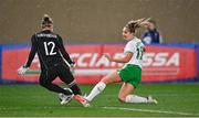 23 February 2024; Kyra Carusa of Republic of Ireland in action against Italy goalkeeper Katja Schroffenegger during the international women's friendly match between Italy and Republic of Ireland at Viola Park in Florence, Italy. Photo by David Fitzgerald/Sportsfile
