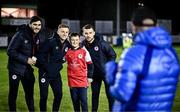 23 February 2024; St Patrick's Athletic supporter Talan Smith with St Patrick's Athletic players, from left, Alex Nolan, Brandon Kavanagh and Aaron Bolger before the SSE Airtricity Men's Premier Division match between St Patrick's Athletic and Bohemians at Richmond Park in Dublin. Photo by Harry Murphy/Sportsfile