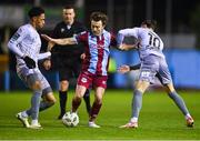 23 February 2024; Darragh Markey of Drogheda United in action against Maleace Asamoah, left, and Connor Parsons of Waterford during the SSE Airtricity Men's Premier Division match between Drogheda United and Waterford at Weavers Park in Drogheda, Louth. Photo by Tyler Miller/Sportsfile