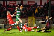 23 February 2024; Rory Gaffney of Shamrock Rovers shoots to score his side's first goal despite the attention of Shelbourne's Gavin Molloy, left, and goalkeeper Conor Kearns during the SSE Airtricity Men's Premier Division match between Shelbourne and Shamrock Rovers at Tolka Park in Dublin. Photo by Stephen McCarthy/Sportsfile
