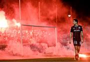 23 February 2024; Dylan Connolly of Bohemians looks on as Bohemians supporters throw flares onto the pitch during the SSE Airtricity Men's Premier Division match between St Patrick's Athletic and Bohemians at Richmond Park in Dublin. Photo by Harry Murphy/Sportsfile