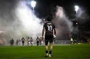 23 February 2024; Dylan Connolly of Bohemians walks towards the tunnel as smoke from flares rises during the SSE Airtricity Men's Premier Division match between St Patrick's Athletic and Bohemians at Richmond Park in Dublin. Photo by Harry Murphy/Sportsfile