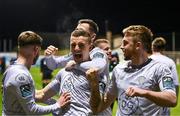 23 February 2024; Darragh Leahy of Waterford, centre, celebrates with team-mates after scoring his side's third goal during the SSE Airtricity Men's Premier Division match between Drogheda United and Waterford at Weavers Park in Drogheda, Louth. Photo by Tyler Miller/Sportsfile