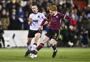 23 February 2024; Robbie Benson of Dundalk is tackled by Aodh Dervin of Galway United during the SSE Airtricity Men's Premier Division match between Dundalk and Galway United at Oriel Park in Dundalk, Louth. Photo by Ben McShane/Sportsfile