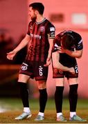 23 February 2024; Cian Byrne of Bohemians reacts after being struck by a flare as teammate Jordan Flores gestures towards the crowd during the SSE Airtricity Men's Premier Division match between St Patrick's Athletic and Bohemians at Richmond Park in Dublin. Photo by Harry Murphy/Sportsfile