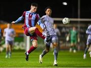 23 February 2024; Evan Weir of Drogheda United in action against Maleace Asamoah of Waterford during the SSE Airtricity Men's Premier Division match between Drogheda United and Waterford at Weavers Park in Drogheda, Louth. Photo by Tyler Miller/Sportsfile