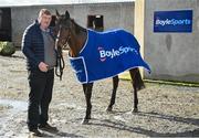 26 February 2024; BoyleSports has announced it is teaming up with John ‘Shark’ Hanlon as his Official Stable Partner. The new multi-year partnership will see the bookmaker gain exclusive access to follow horse racing hero Hewick on his journey to the Cheltenham Gold Cup as well as a host of other big feature races throughout 2024/2025. To mark the 100th year of the Cheltenham Gold Cup, BoyleSports has also pledged to donate €100,000 to the Irish Injured Jockeys (IIJ) and the Inured Jockey’s Fund (IJF) if Hewick wins the race. Pictured is horse trainer John ‘Shark’ Hanlon, and Hewick, at his yard in Fenniscourt, Carlow. Photo by Seb Daly/Sportsfile