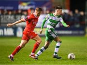 23 February 2024; Darragh Burns of Shamrock Rovers in action against JJ Lunney of Shelbourne during the SSE Airtricity Men's Premier Division match between Shelbourne and Shamrock Rovers at Tolka Park in Dublin. Photo by Stephen McCarthy/Sportsfile