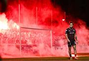 23 February 2024; Dylan Connolly of Bohemians looks on as Bohemians supporters throw flares onto te pitch during the SSE Airtricity Men's Premier Division match between St Patrick's Athletic and Bohemians at Richmond Park in Dublin. Photo by Harry Murphy/Sportsfile
