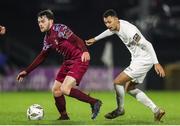 23 February 2024; Jack Larkin of Cobh Ramblers in action against Dean Ebbe of Athlone Town during the SSE Airtricity Men's First Division match between Cobh Ramblers and Athlone Town at Turner's Cross in Cork. Photo by Michael P Ryan/Sportsfile