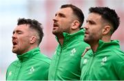 24 February 2024; Ireland captain Peter O'Mahony, left, leads his teammates Tadhg Beirne and Conor Murray during the national anthems before the Guinness Six Nations Rugby Championship match between Ireland and Wales at Aviva Stadium in Dublin. Photo by Sam Barnes/Sportsfile