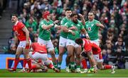 24 February 2024; Bundee Aki of Ireland is congratulated by teammates Josh van der Flier, Dan Sheehan and James Lowe after winning a turnover during the Guinness Six Nations Rugby Championship match between Ireland and Wales at Aviva Stadium in Dublin. Photo by Seb Daly/Sportsfile