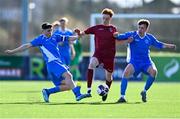 24 February 2024; Edward Silke of Galway Football Association is tackled by Sam Conway, left, and Xhorxhi Ginji of Dublin & District Schoolboys League during the FAI Youth Inter League Cup final match between Dublin & District Schoolboys League and Galway Football Association at Athlone Town Stadium in Westmeath. Photo by Tyler Miller/Sportsfile