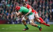 24 February 2024; Josh van der Flier of Ireland is tackled by Nick Tompkins of Wales during the Guinness Six Nations Rugby Championship match between Ireland and Wales at Aviva Stadium in Dublin. Photo by Seb Daly/Sportsfile