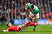 24 February 2024; Dan Sheehan of Ireland is tackled by Sam Costelow of Wales during the Guinness Six Nations Rugby Championship match between Ireland and Wales at Aviva Stadium in Dublin. Photo by Ramsey Cardy/Sportsfile