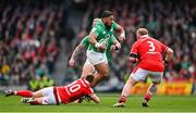 24 February 2024; Bundee Aki of Ireland is tackled by Sam Costelow of Wales during the Guinness Six Nations Rugby Championship match between Ireland and Wales at Aviva Stadium in Dublin. Photo by Ramsey Cardy/Sportsfile