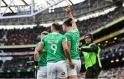 24 February 2024; James Lowe of Ireland celebrates with teammate Jamison Gibson-Park after scoring their side's second try in the 32nd minute during the Guinness Six Nations Rugby Championship match between Ireland and Wales at Aviva Stadium in Dublin. Photo by Seb Daly/Sportsfile