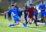 24 February 2024; Ben McDonnell of Galway Football Association is tackled by Sam Conway of Dublin & District Schoolboys League during the FAI Youth Inter League Cup final match between Dublin & District Schoolboys League and Galway Football Association at Athlone Town Stadium in Westmeath. Photo by Tyler Miller/Sportsfile