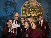 24 February 2024; Uachtarán Chumann Lúthchleas Gael Jarlath Burns takes a selfie with students from St Paul's High School Bessbrook, Armagh, where he will return as Principal after his term ends, after the GAA Congress at Canal Court Hotel in Newry, Down. Photo by Piaras Ó Mídheach/Sportsfile