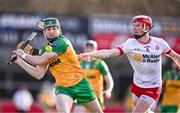 24 February 2024; Josh Cronolly McGee of Donegal in action against Fionn Devlin of Tyrone during the Allianz Hurling League Division 2 Group B match between Tyrone and Donegal at O'Neills Healy Park in Omagh, Tyrone. Photo by Ben McShane/Sportsfile