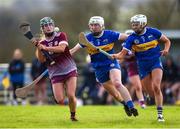 24 February 2024; Niamh Mc Peake of Galway is tackled by Mairéad Eviston, left, and Clodagh McIntyre of Tipperary during the Very Camogie League Division 1 match between Tipperary and Galway at The Ragg GAA Grounds in Tipperary. Photo by Tom Beary/Sportsfile