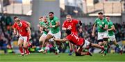 24 February 2024; Bundee Aki of Ireland beats the tackle of Dafydd Jenkins of Wales during the Guinness Six Nations Rugby Championship match between Ireland and Wales at Aviva Stadium in Dublin. Photo by Ramsey Cardy/Sportsfile