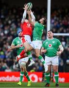 24 February 2024; Cameron Winnett of Wales contests a high ball with Jamison Gibson-Park of Ireland during the Guinness Six Nations Rugby Championship match between Ireland and Wales at Aviva Stadium in Dublin. Photo by Seb Daly/Sportsfile