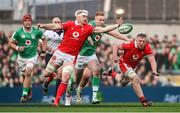 24 February 2024; Aaron Wainwright of Wales and Ciarán Frawley of Ireland chase a loose ball during the Guinness Six Nations Rugby Championship match between Ireland and Wales at Aviva Stadium in Dublin. Photo by Sam Barnes/Sportsfile