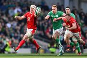 24 February 2024; Aaron Wainwright of Wales and Ciarán Frawley of Ireland contest a loose ball during the Guinness Six Nations Rugby Championship match between Ireland and Wales at Aviva Stadium in Dublin. Photo by Ramsey Cardy/Sportsfile